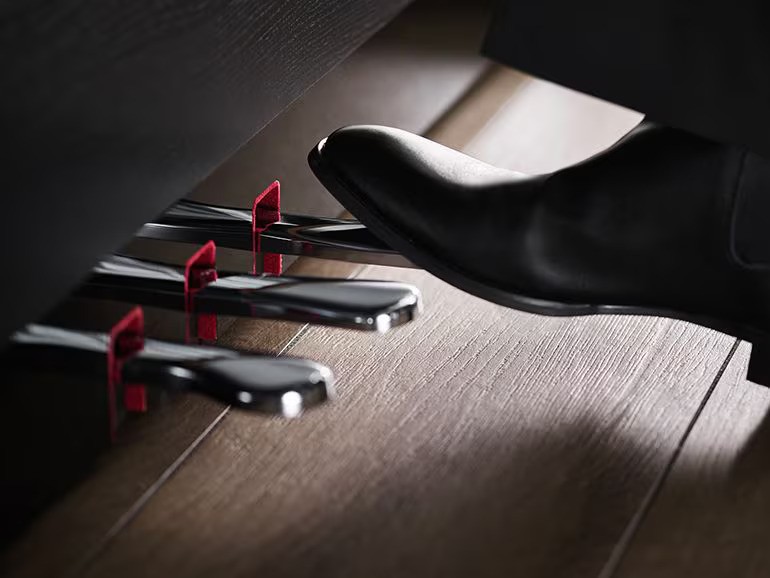 Keys and pedals that allow players to create the intended sound with the same feel as a grand piano